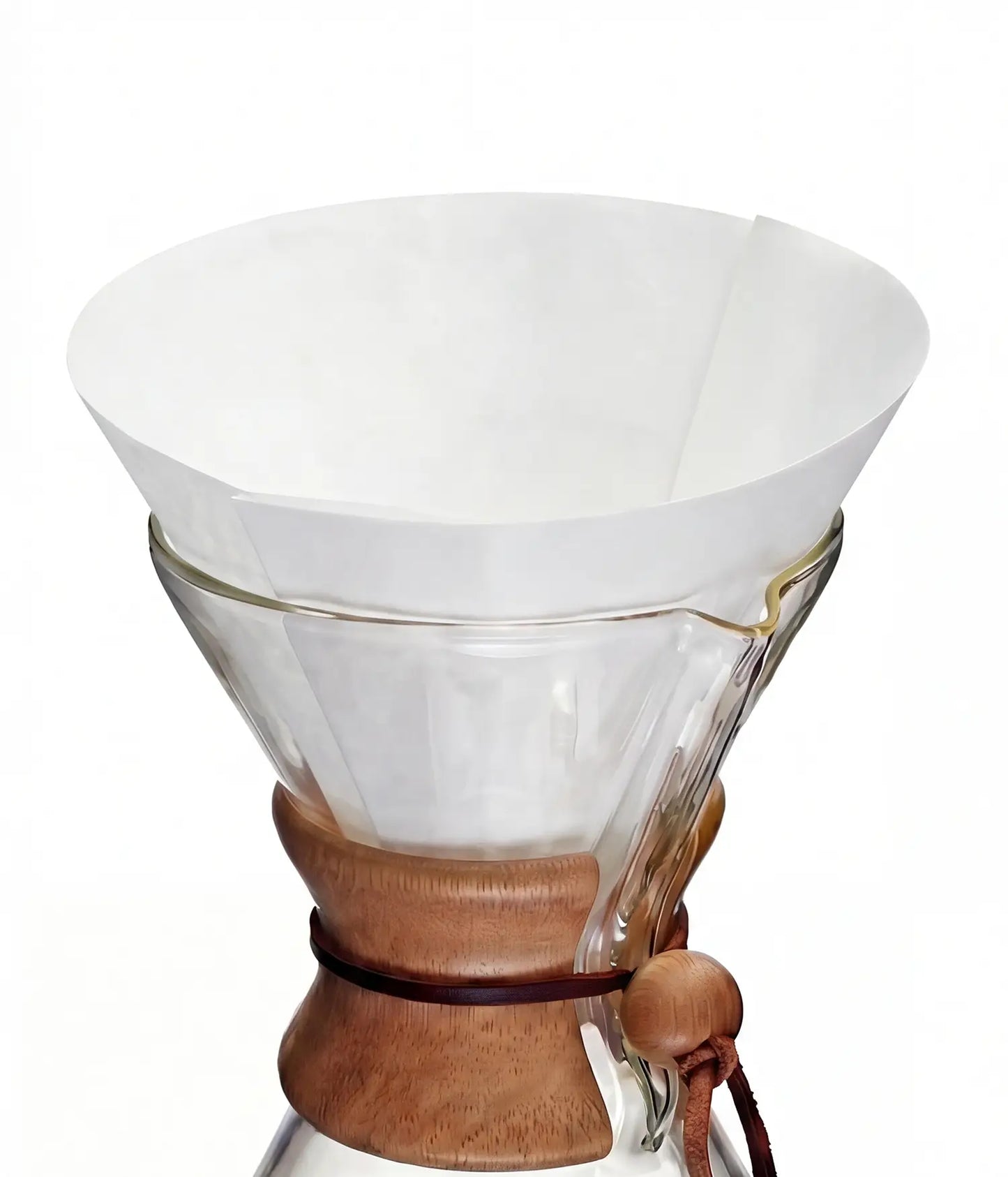 A pure white 25cm circle pre-folded coffee filter sitting perfectly inside a classic glass pour-over coffee maker.