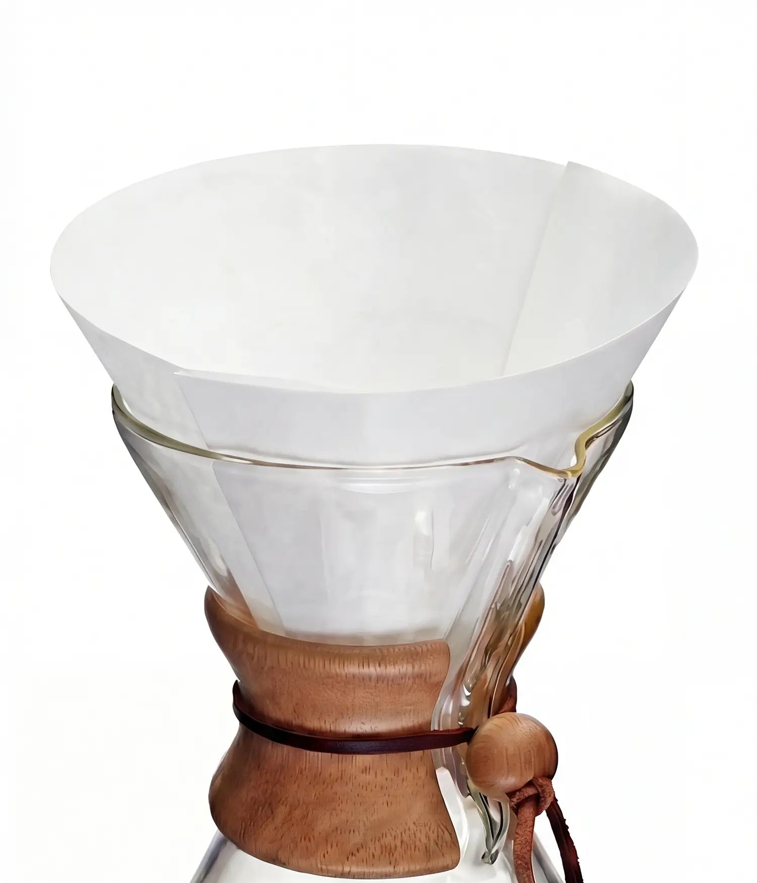 A pure white 25cm circle pre-folded coffee filter sitting perfectly inside a classic glass pour-over coffee maker.