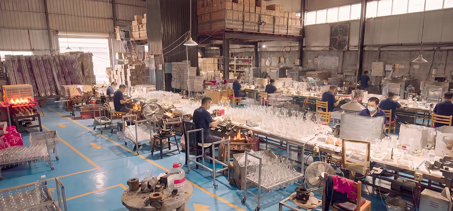 A wide view inside the AGOGO dedicated manufacturing facility, showcasing our 11 years of engineering expertise with skilled craftsmen working on the production line to create high-borosilicate glass coffee gear.