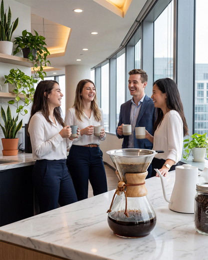 Colleagues sharing a fresh brew from the large capacity AGOGO classic pour over coffee maker in a modern office pantry.