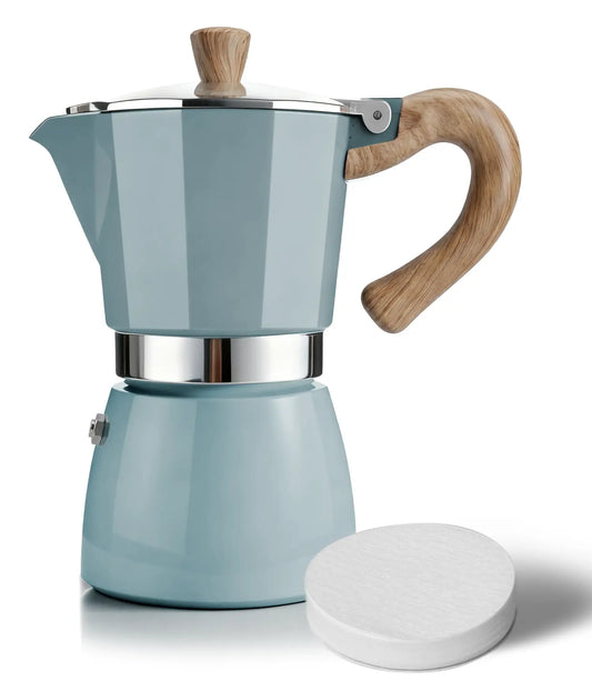 A sleek lake blue AGOGO Milano Moka Pot featuring a wood-style handle, placed next to a precision round paper filter on a pure white background.