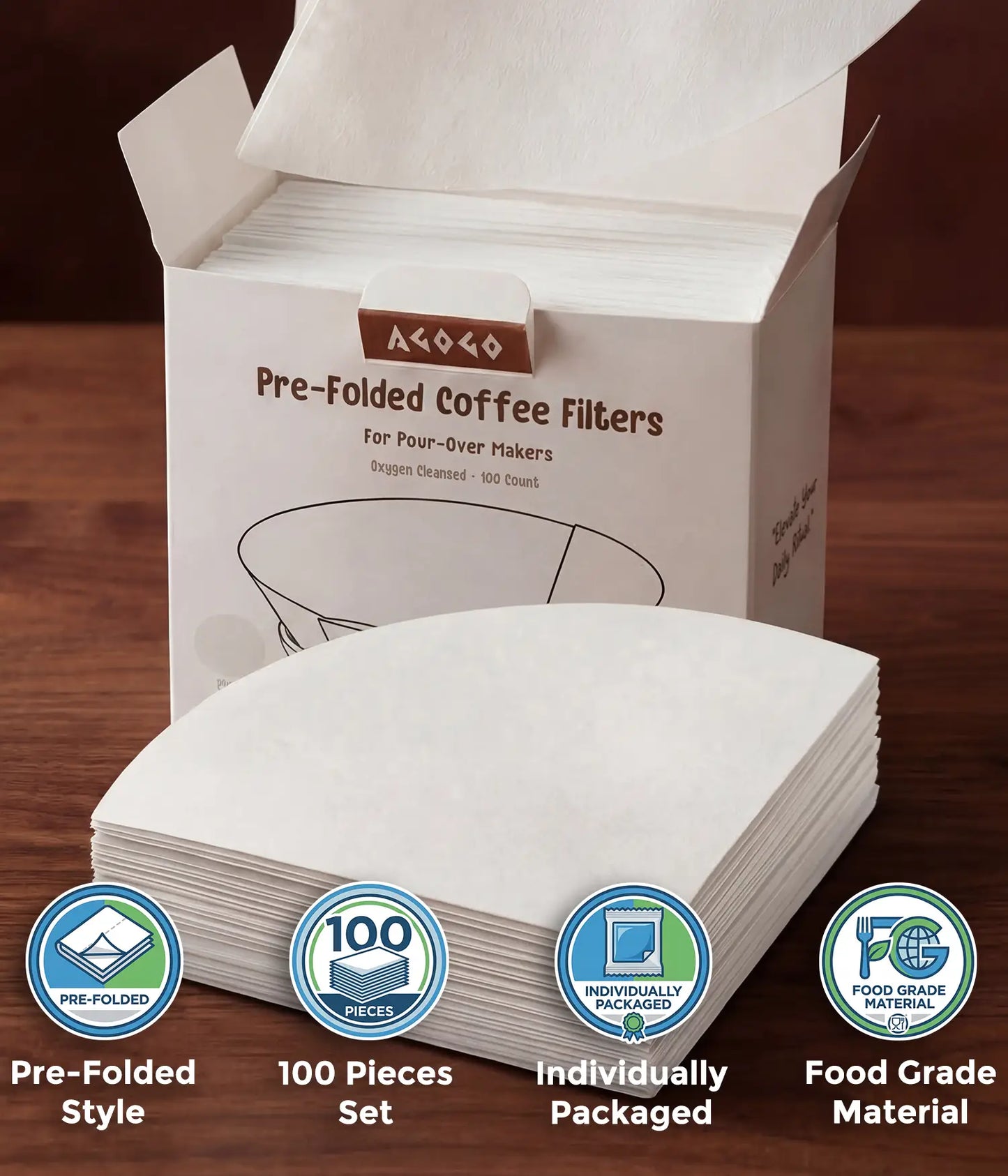 A hand taking a pure white circular coffee filter from the AGOGO 100-count value box, with a stack of oxygen-cleansed half-moon pre-folded filters resting on a wooden table.