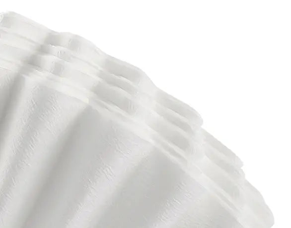 Macro detail of the premium natural wood-fiber paper coffee filter included with the AGOGO pour over set, designed to remove fines for a clean, sediment-free extraction.