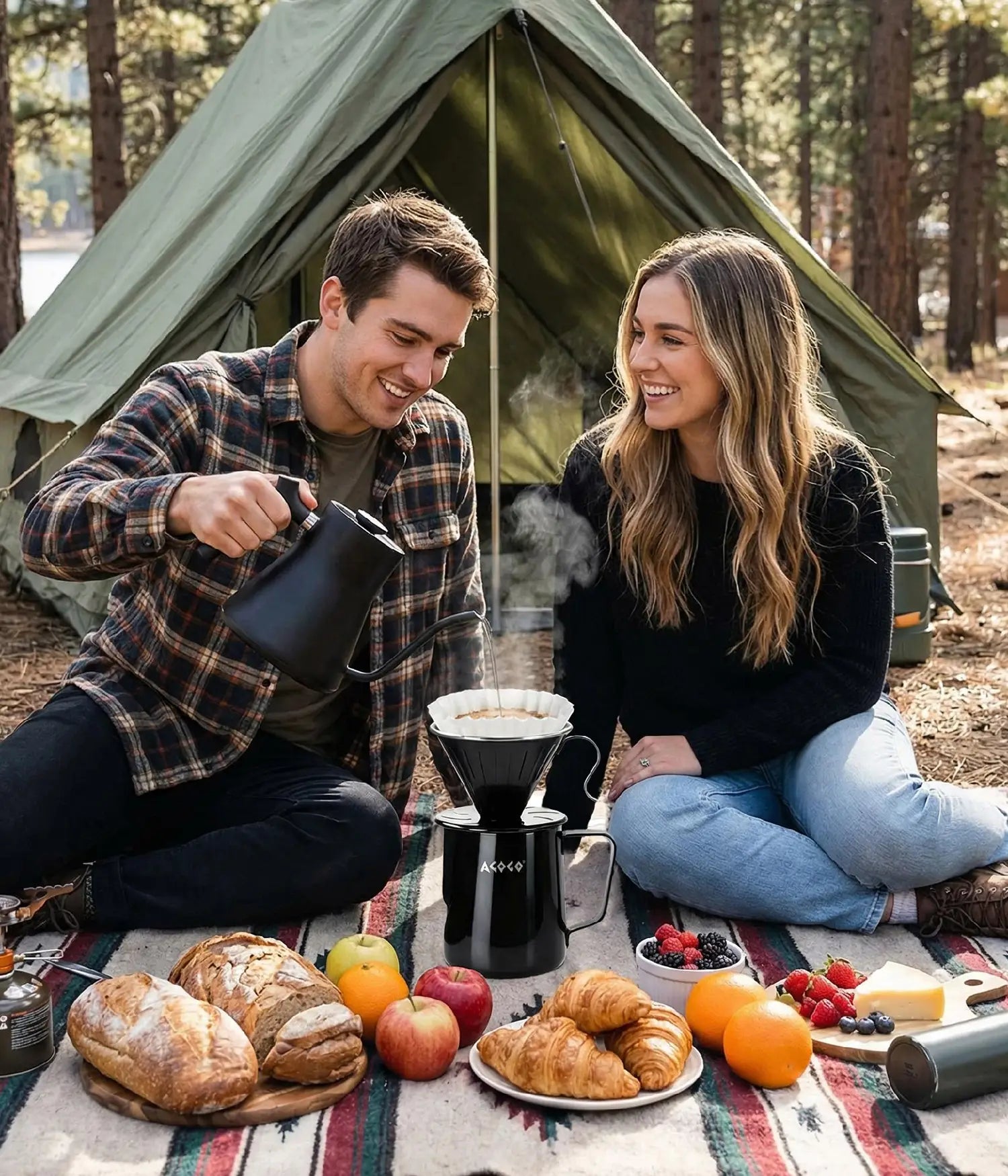 Happy couple enjoying a sunny outdoor picnic by their tent, brewing fresh coffee with the highly durable, large capacity 900ml AGOGO matte black stainless steel pour over maker.